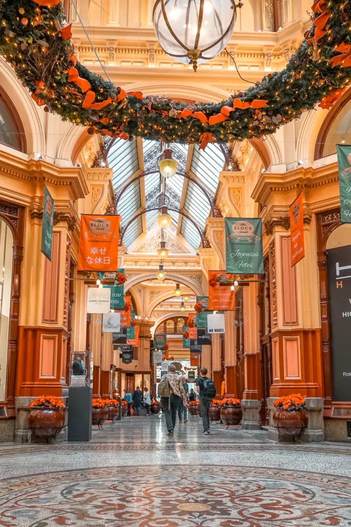 Christmas decorations hang up in the Block Arcade in Melbourne, a beautiful arcade with ornate cornices and glass ceiling. This is one of the places most walking tours of Melbourne visit