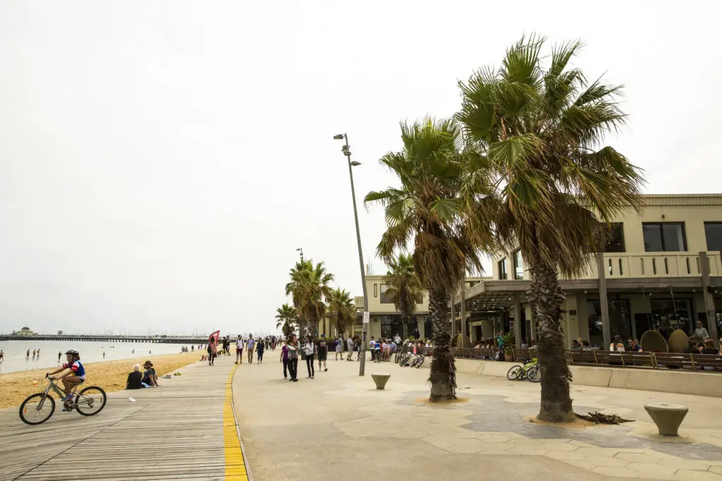Save money by grabbing fish and chips and heading for some people watching at St Kilda Beach
