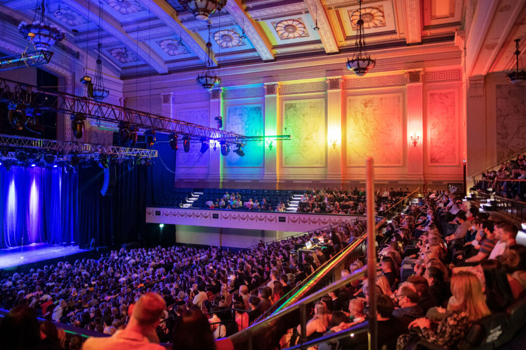 Crowds of people watch a performance at the Melbourne International Comedy Festival. It's one of the best things to do in Melbourne during March and April.