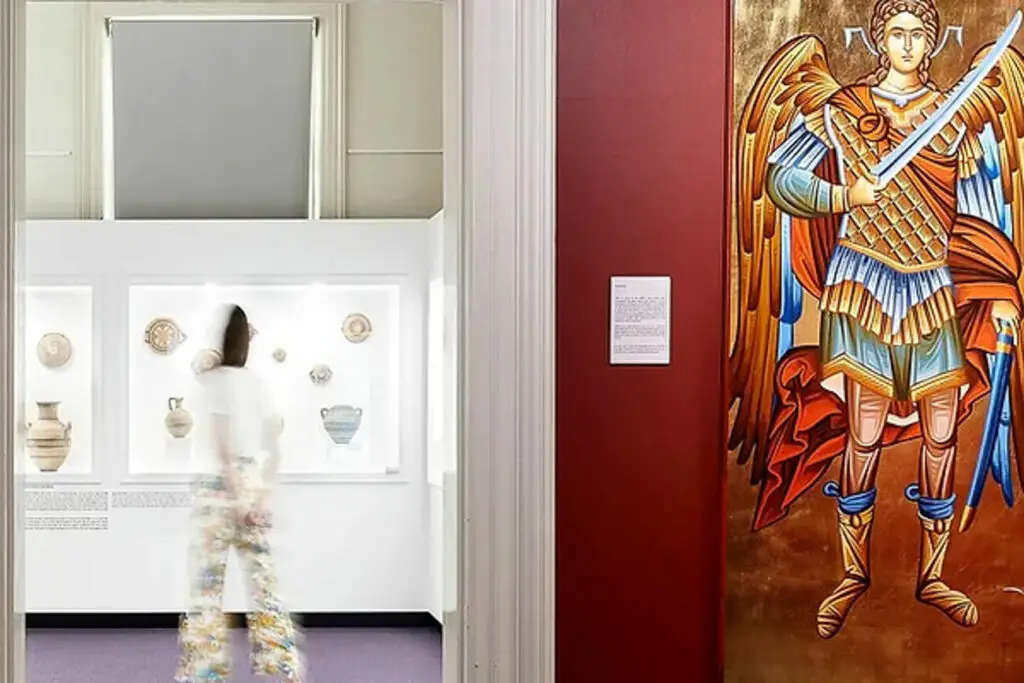 Inside the Hellenic Museum in Melbourne, a Greek museum that celebrates Greek culture. A person is blurred but can be seen looking at an exhibit.