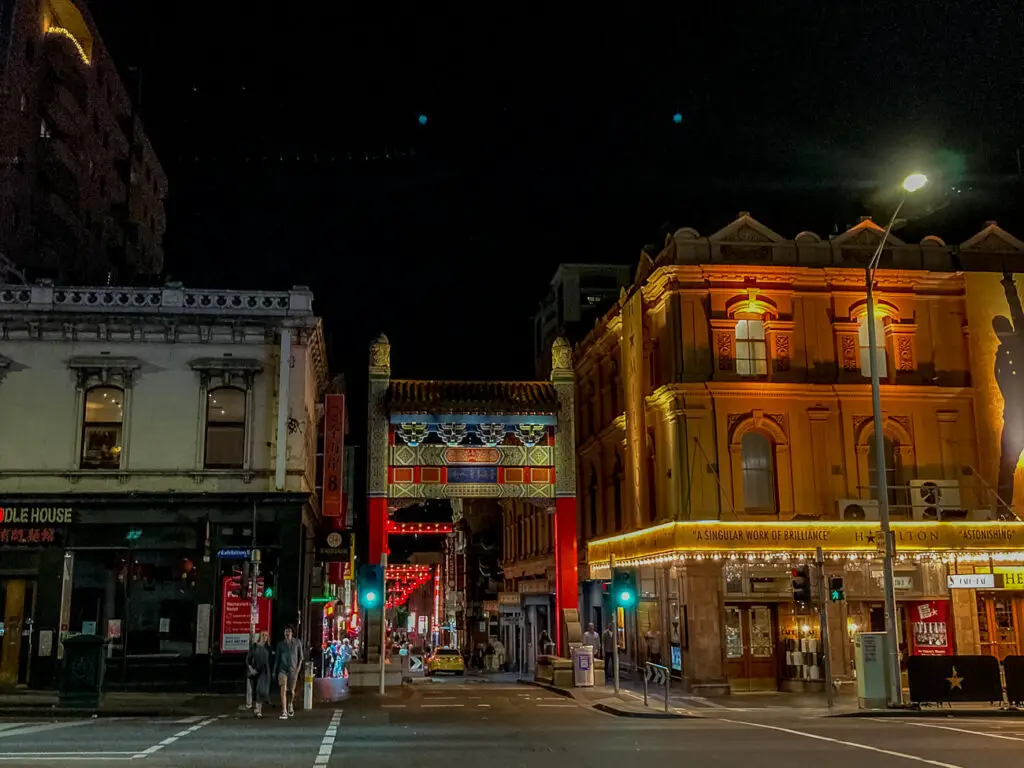One of the most popular places to visit on ghost tours in Melbourne is Chinatown - the entrance to Chinatown in Melbourne at night time