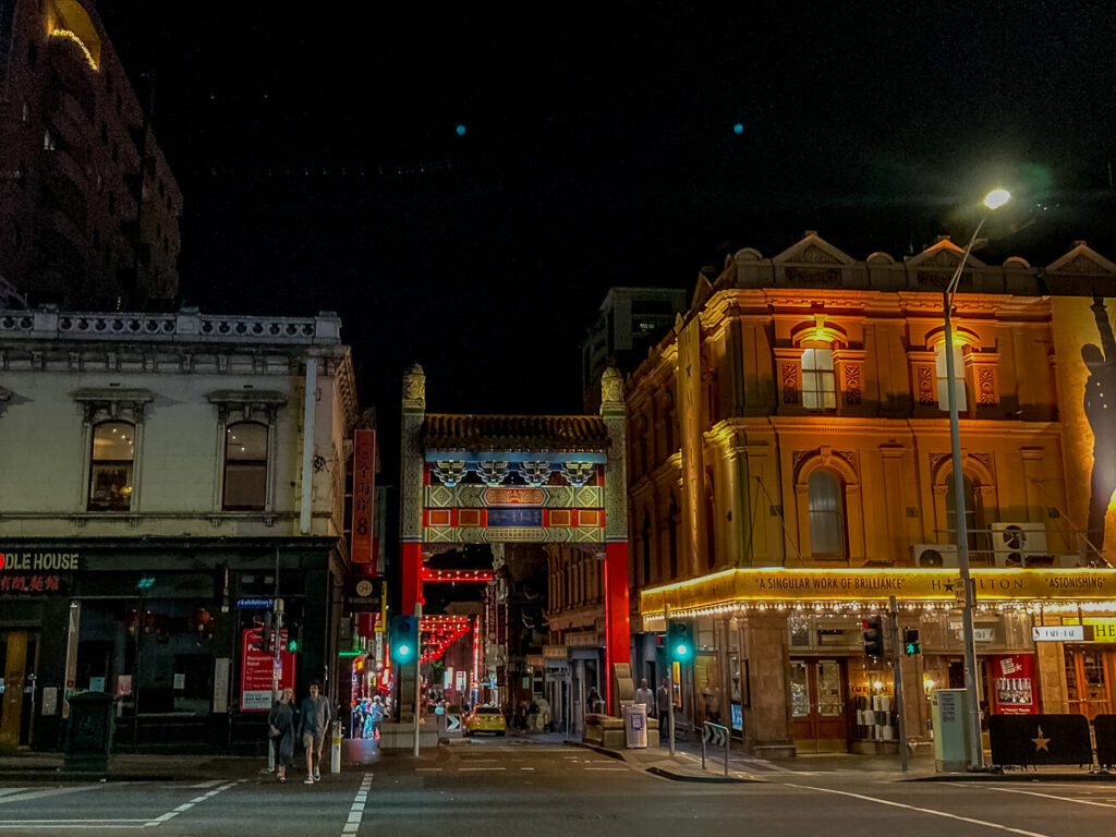 Chinatown in Melbourne is eerily lit up on a dark night