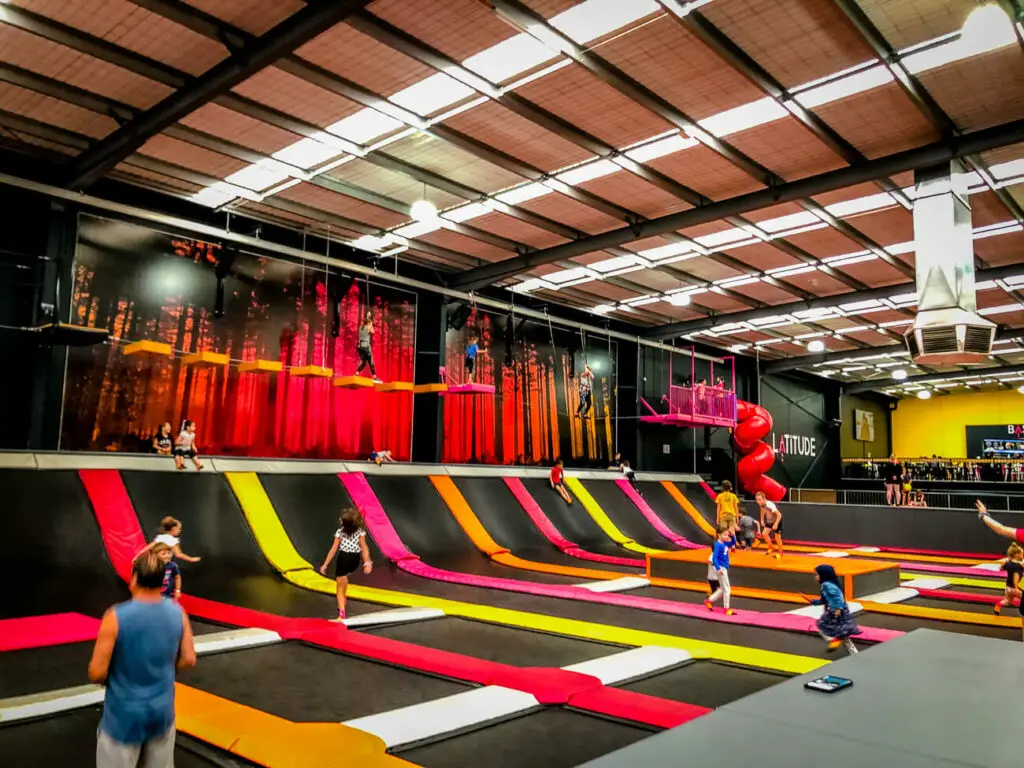 Kids play inside a colourful indoor trampoline and bounce centre in Melbourne. These centres are one of the best Melbourne kids activities.